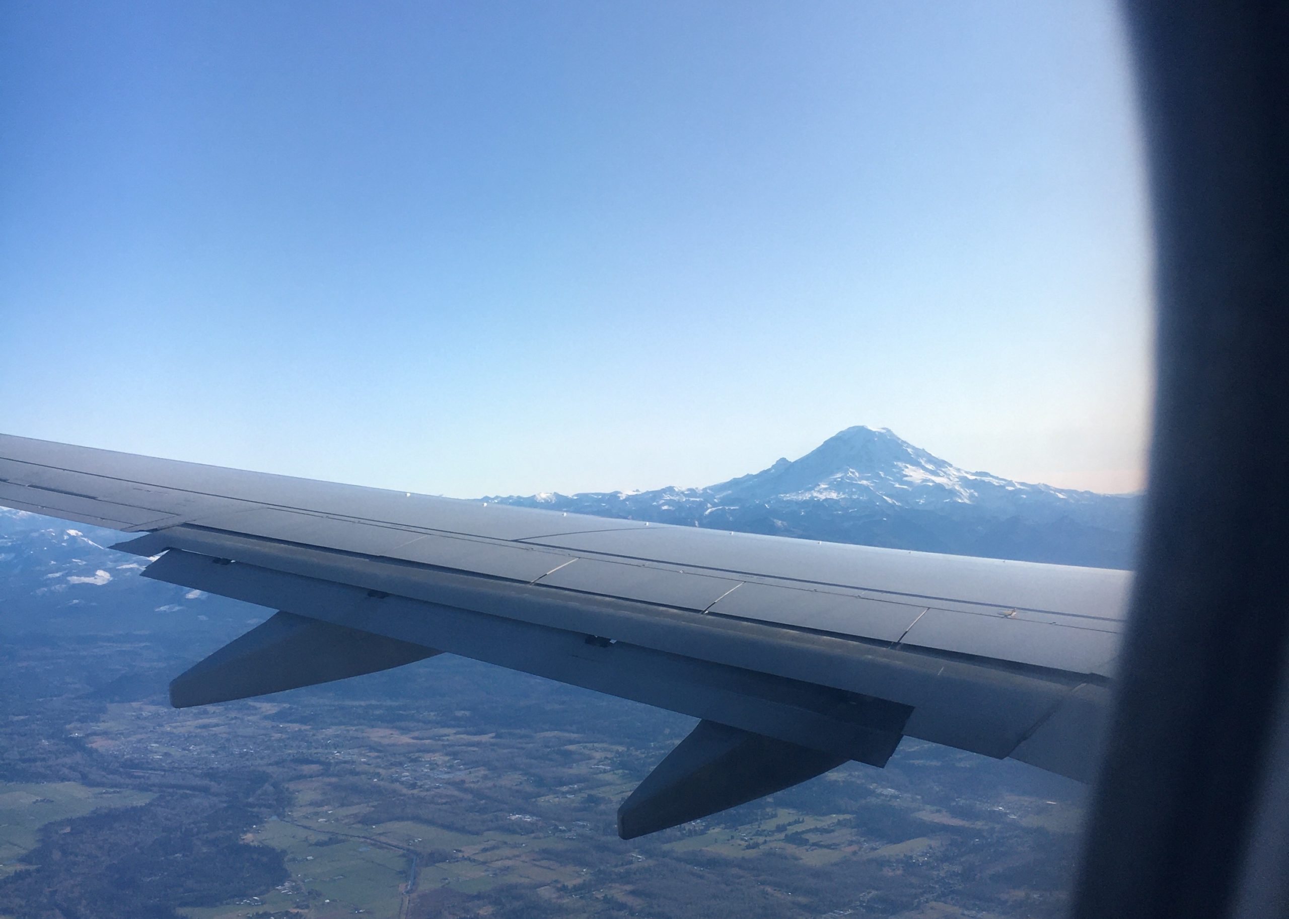 An ariail view of an airplane wing over the Pacific Northwest in an unseasonably dry November. Tahoma (Mt. Rainier) can be seen clearly in the distance.