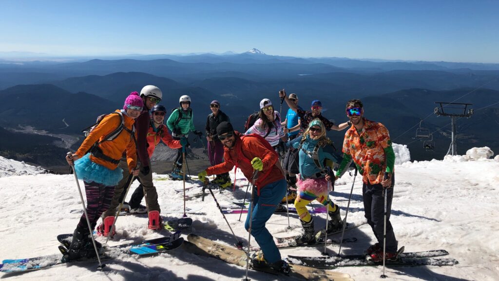 A group of skiers enjoying August turns.