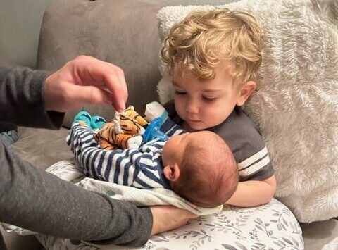 Big brother Lucca Nello meets baby Carlo Jordan Tursi.